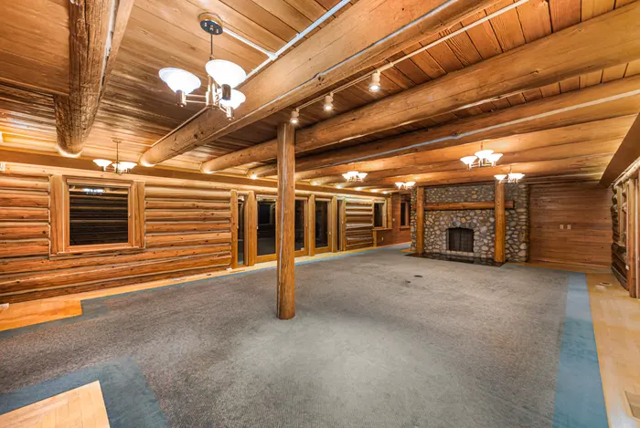 Large log great room with fireplace