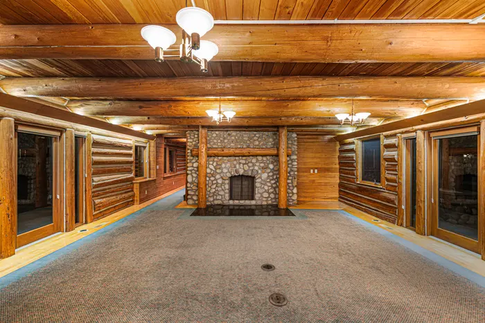 Cabin living room centered on the fireplace