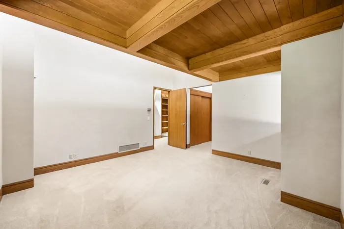 Bedroom with timber ceiling detail
