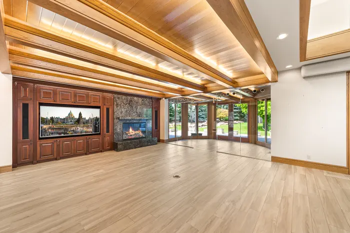 Wood-paneled living room with fireplace
