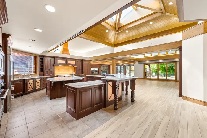 Kitchen opening to the timber-framed great room