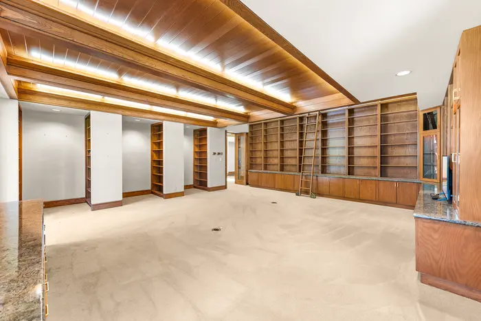 Wood-paneled library and media room