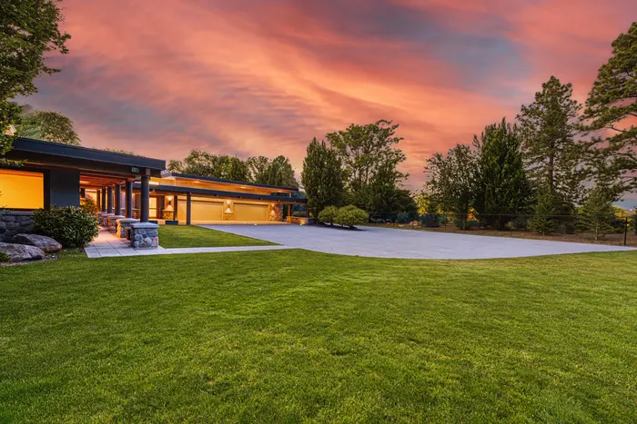 Main residence across the lawn at twilight