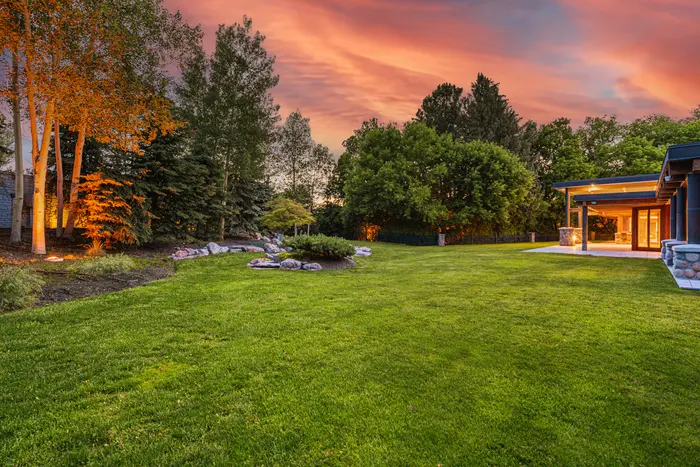 Landscaped lawn and garden at twilight